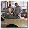 couple looking at a car